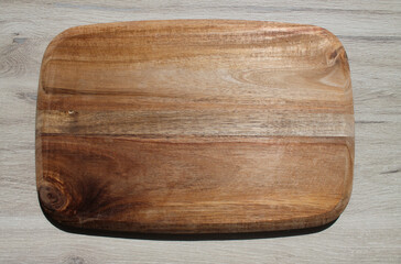 Acacia wood board, wooden background. High quality photo
