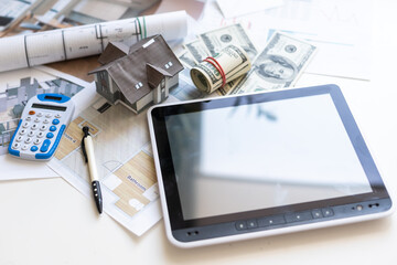 Blueprints for a house and a yellow ruler