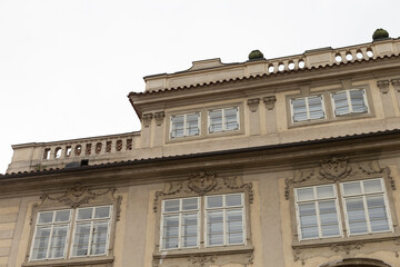 A large and impressive building that features a balcony located on its top, offering scenic views and architectural charm