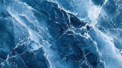 Obraz premium Cracked icy surface creating abstract blue pattern