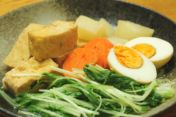 Eggs, fried tofu, simmered vegetables such as carrots and radishes, Japanese home cooking