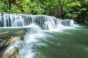 Beautiful deep forest waterfall in Thailand. nature background.