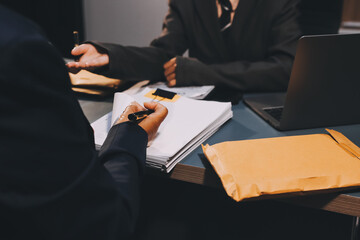 Judge gavel with Justice lawyers having team meeting at law firm background. Concepts of Law and...