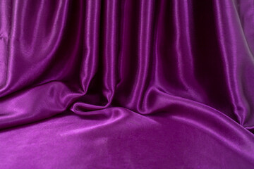 Fototapeta premium staged purple satin with folds and empty space for text or product placement