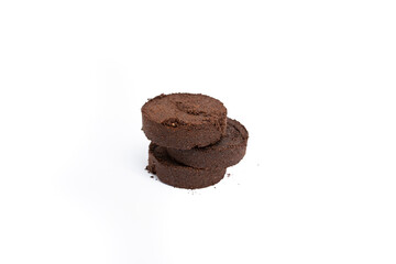 Three dry coffe maker pucks stacked on white background