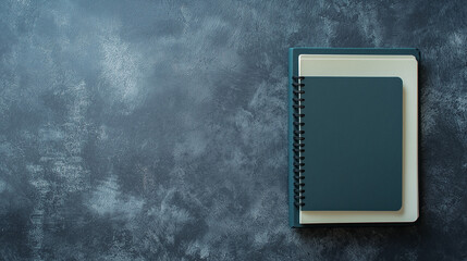 Notebooks rest on a textured surface, symbolizing the journey of exploring psychological health and personal development concepts in a quiet moment of reflection, copy space