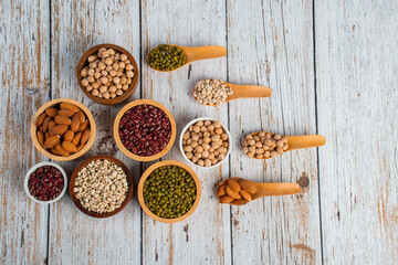 Mung beans, Red kidney beans, Chickpeas source and peeled barley in a basket wooden isolated on wood background