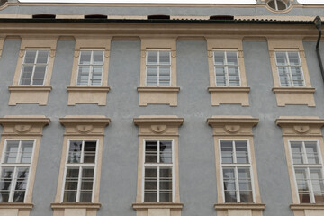 A large structure that features numerous windows adorning its exterior, showcasing a modern and inviting design