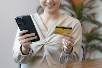 woman making payments from POS device with credit card