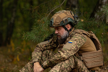 profile portrait of a military man in a helmet and body armor