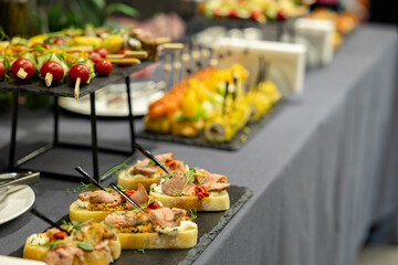 Tasty bruschetta with tender veal on French mustard. Easy cook, nutritious snack. Beautifully decorated catering banquet menu. Food snacks for buffet.