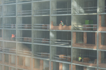 Construction of apartment buildings, dense urban development. The process of construction of...