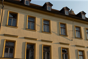 This is a structure that features numerous windows and has a roof on top, providing an aesthetic appeal to the overall appearance of the building