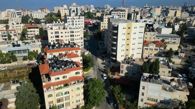 Gold-clad minaret and the skyline of Ramallah, capital of the Palestinian Territories in the occupied West Bank