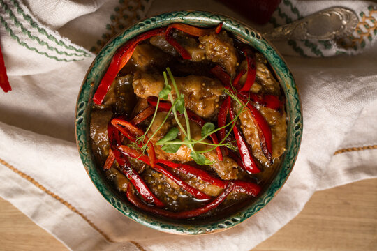 Stew with chicken, vegetables and microgreens pea sprouts, photo in a rustic style