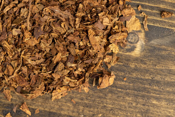 a broken and colored cigar made of high-quality tobacco leaves