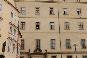A remarkably large building featuring a striking yellow moustache artfully displayed in the window,...