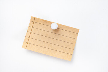 Blank note with lines pinned on board