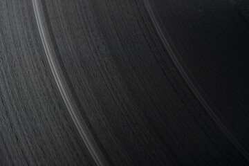 Extreme close-up of the grooves of a vinyl record