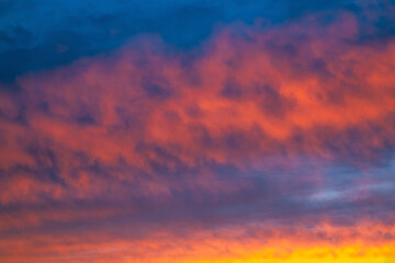 Fototapeta premium A beautiful sunset with pink clouds on a dark blue sky