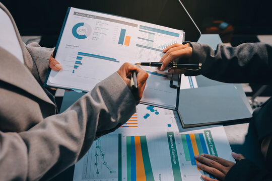 Team of business people are meeting to analyze data for marketing plan,Market research reports and income statistics, Financial and Accounting concept.