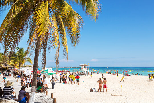 Crowded tropical beach on the caribbean sea, Mexico