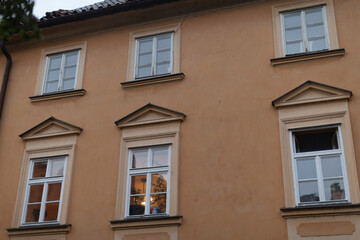 This is a structure that features numerous windows scattered throughout its design, creating a...