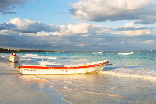 Fishing boat at sunset on the beach, Tulum, Mexico