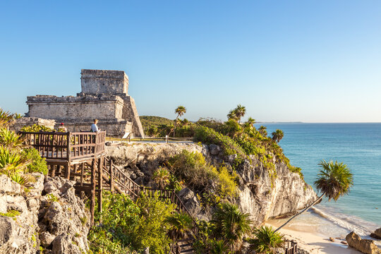 Man visiting the mayan ruins of Tulum, Mexico