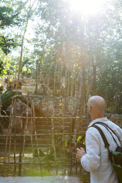 Tourist in the lush forest of Yucatan, Mexico