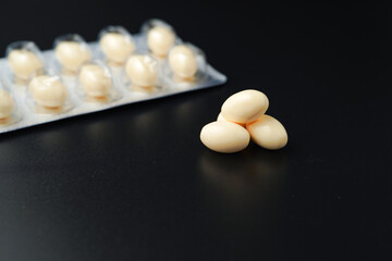 Vitamin in white soft gels capsules, Fish oil, omega 3, omega 9, vitamin D, vitamin E