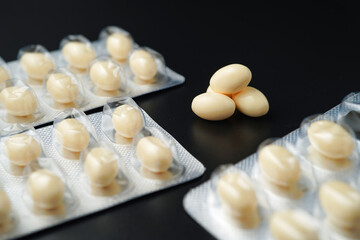 Vitamin in white soft gels capsules, Fish oil, omega 3, omega 9, vitamin D, vitamin E