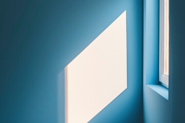 A Window Casting a Diagonal Shadow on a Blue Wall