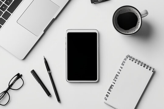 Minimalist Workspace with Laptop, Coffee Cup, and Notepad