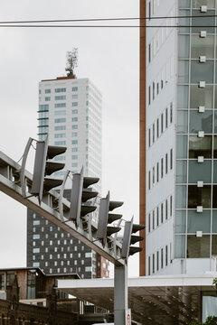A futuristic city scene with towering skyscrapers made of glass and metal representing architectural innovation and modern urban development surrounded by technology.