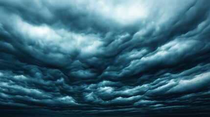 Dramatic dark storm clouds filling the sky, creating a foreboding atmosphere with distinct swirling patterns and textured appearance, suggesting impending heavy rain or storm.
