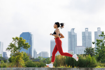 woman running jogging in park outdoor in city center