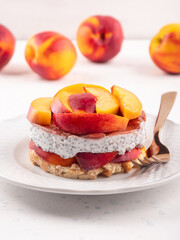 Overnight chia pudding dessert with greek yogurt, peaches and jam