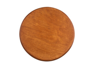 Round wooden tabletop resting on a plain surface in a well-lit room