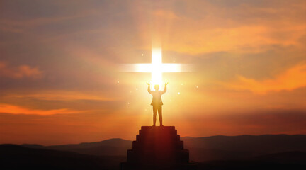 Praying, blessing and expressing faith in God of Christianity. Silhouette of businessman standing...
