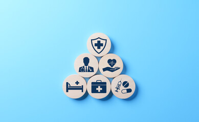 Health insurance and medical care concept. A set of wooden blocks displaying health-related icons,...