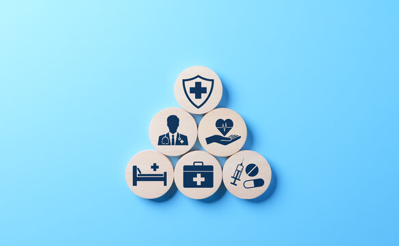 Health insurance and medical care concept. A set of wooden blocks displaying health-related icons, medical care, health insurance, and medication. healthcare services, protection, insurance coverage,