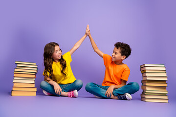 Full body photo of cute little boy girl books high five dressed stylish yellow orange clothes...