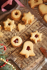 Homemade Linzer Christmas cookies filled with red marmalade