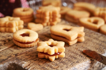 Traditonal Linzer Christmas cookies filled with strawberry marmalade, close up