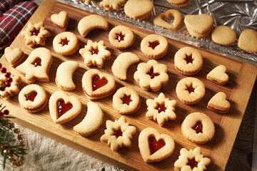 Traditonal Linzer Christmas cookies filled with red strawberry marmalade
