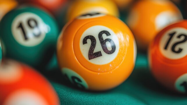 Colorful bingo balls displayed on a vibrant green surface, featuring the number 26 prominently under soft lighting