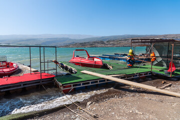 pleasure speedboats for tourists and visitors at the pier on the Chirkeysky reservoir