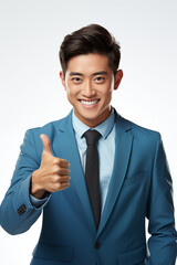 Smiling man in a light blue color formal outfit standing in a studio
