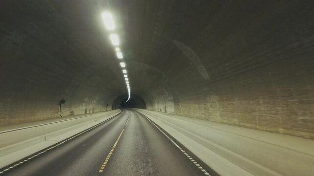 Car point of view driving in tunnel